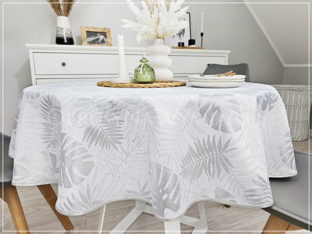 Obrus plamoodporny DE LUX MONSTERA SREBRNA wykończony srebrną lamówką